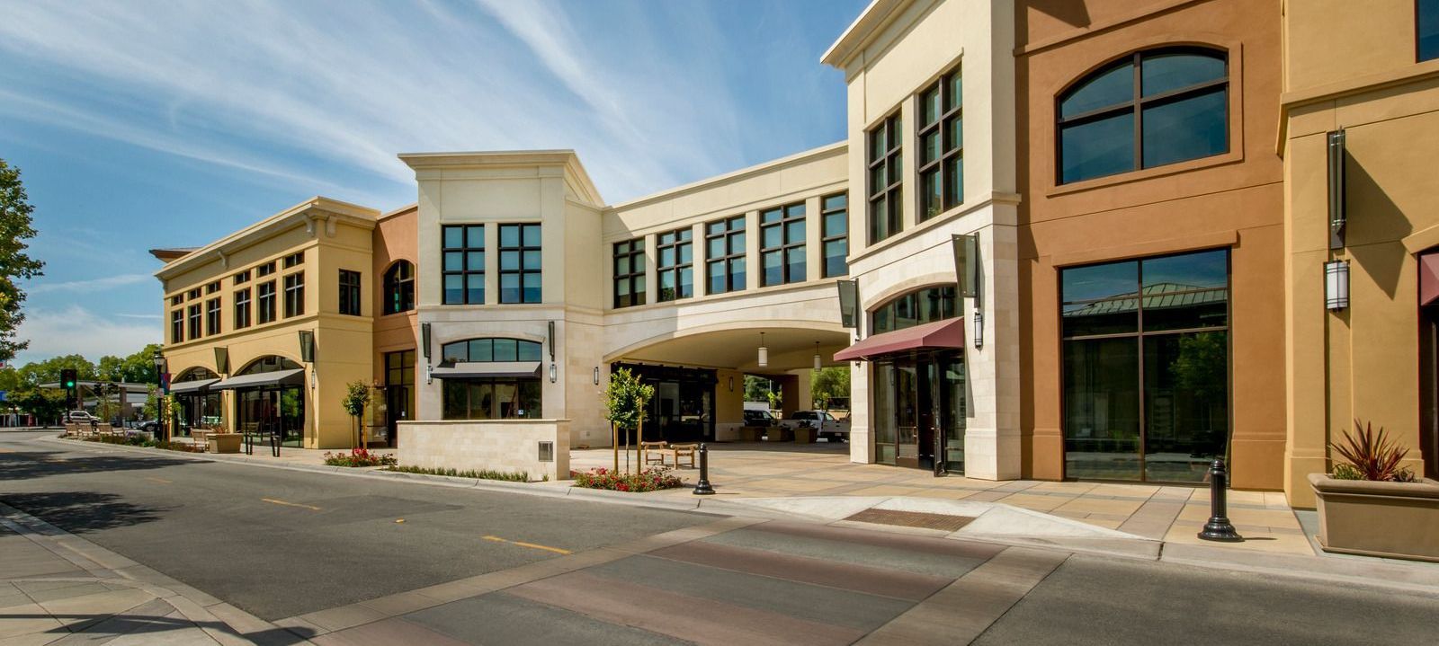 Multi-tenant commercial building exterior with parking lot