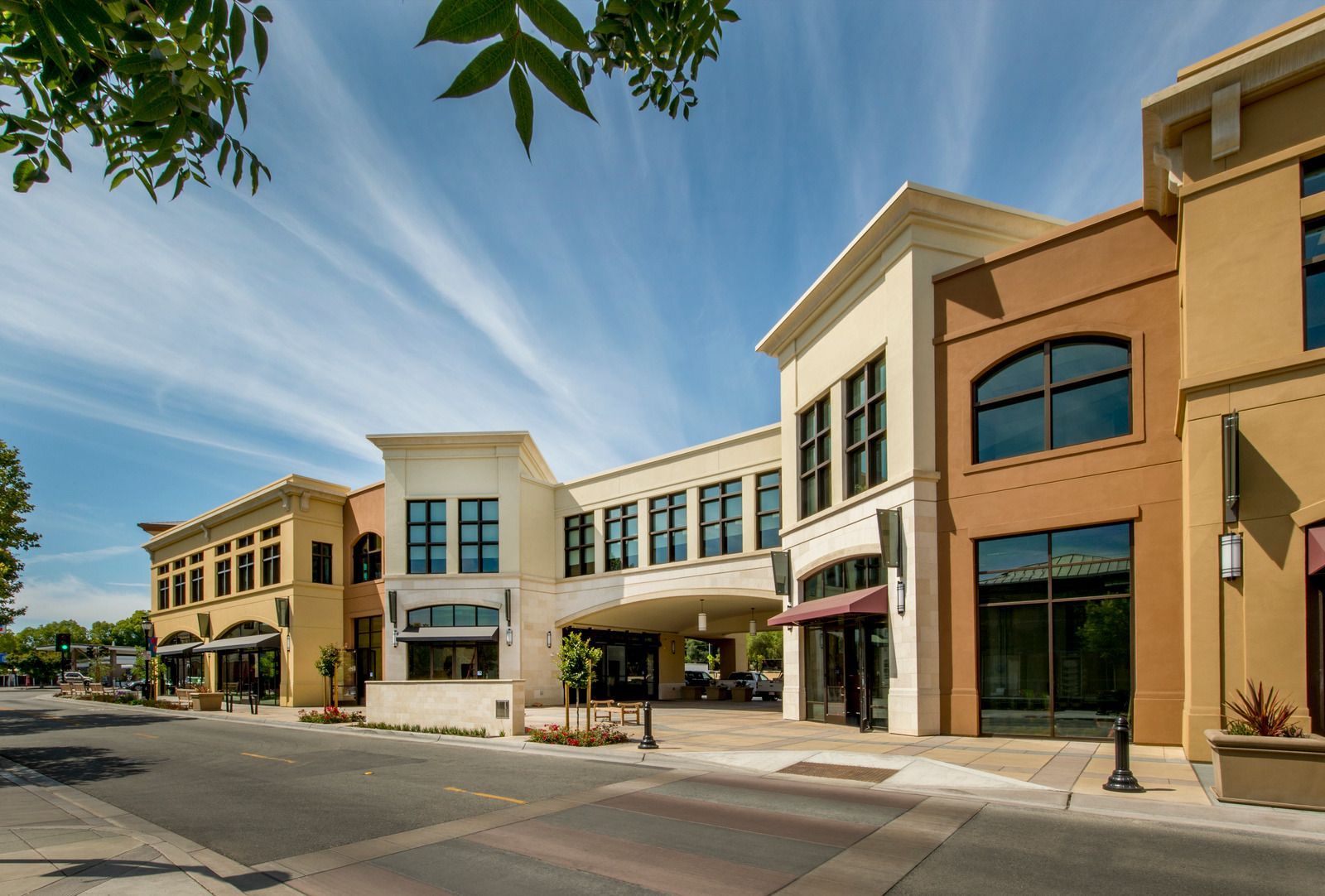 Long retail strip building with covered walkway